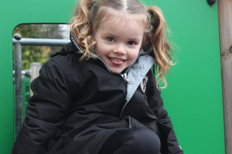 Child playing on the slide